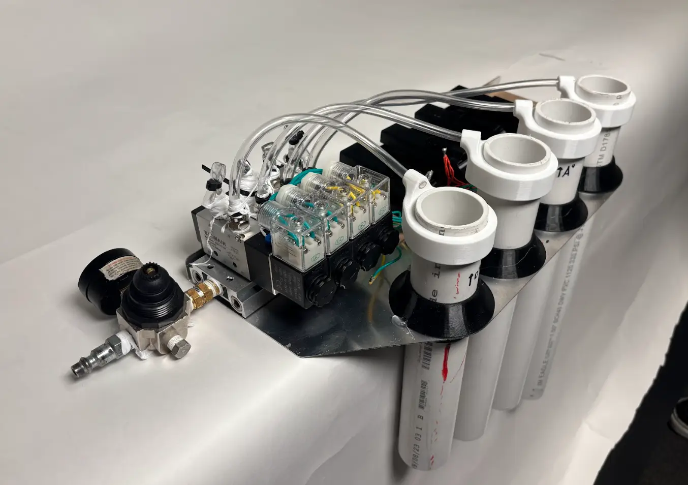 Detail of the solenoid manifold and tuned pipes
