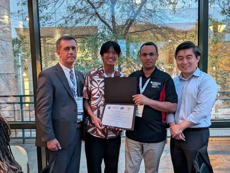 AJ receiving an award certificate at the ASEE 2026 conference