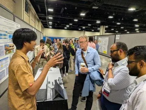 AJ presenting his research poster at the ASEE conference