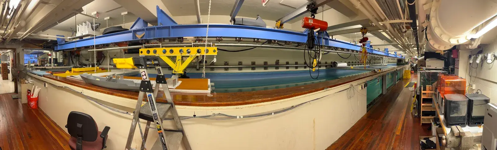 Panorama of the MIT tow-tank facility with the carriage over the tank