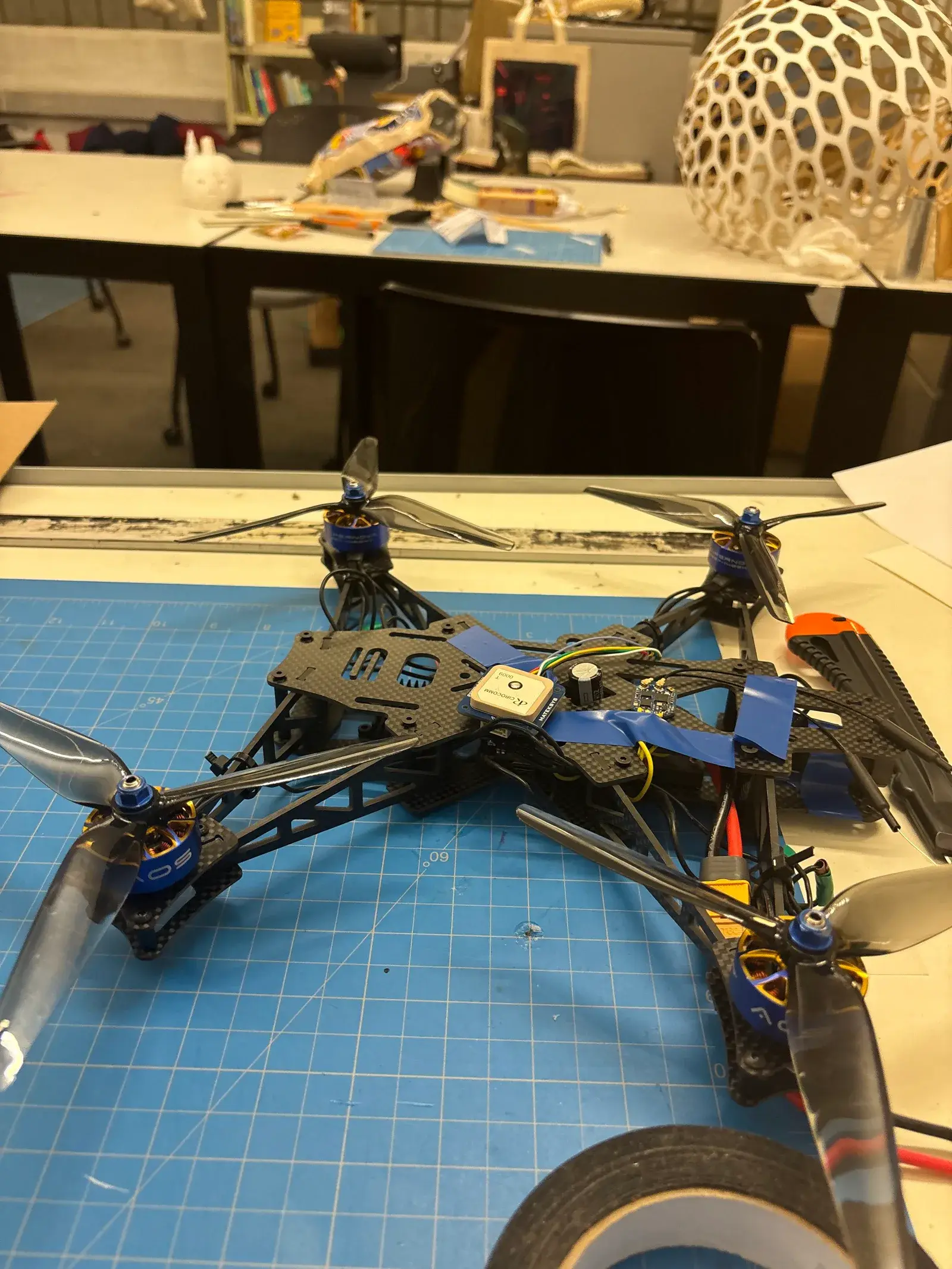 A larger airframe from the Geolabs fleet, assembled on a cutting mat