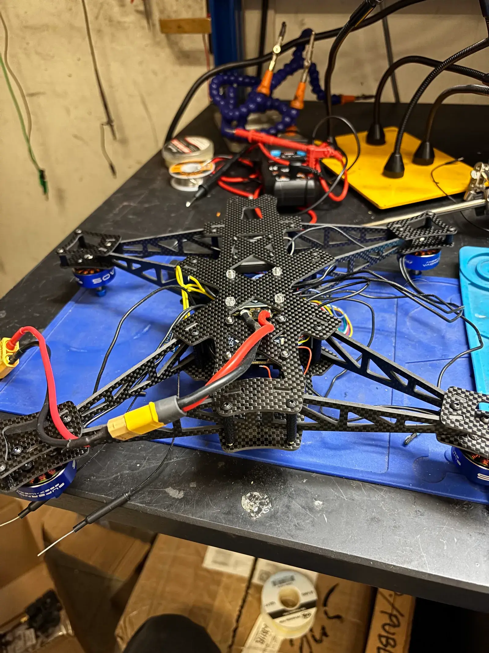 The carbon-fiber frame mid-build, with motors mounted and wiring in progress