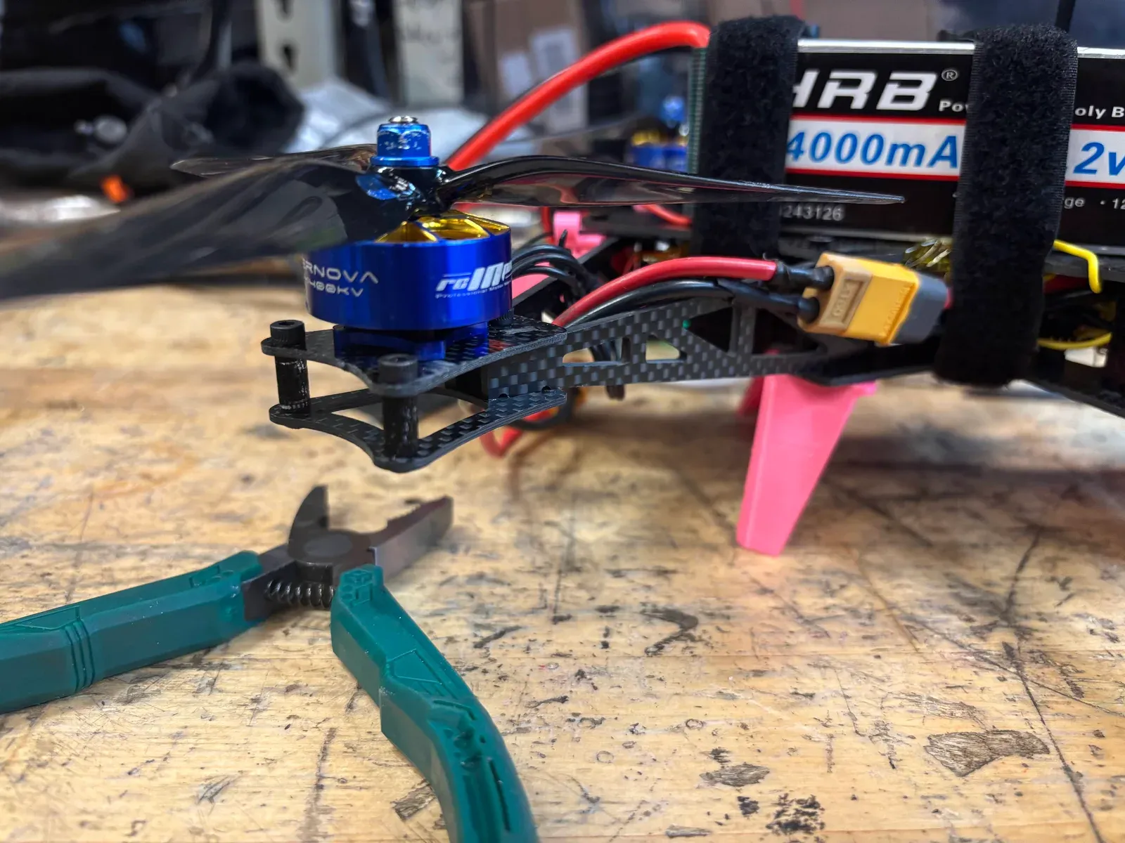 The AOS Supernova motor on the frame arm, with the battery behind