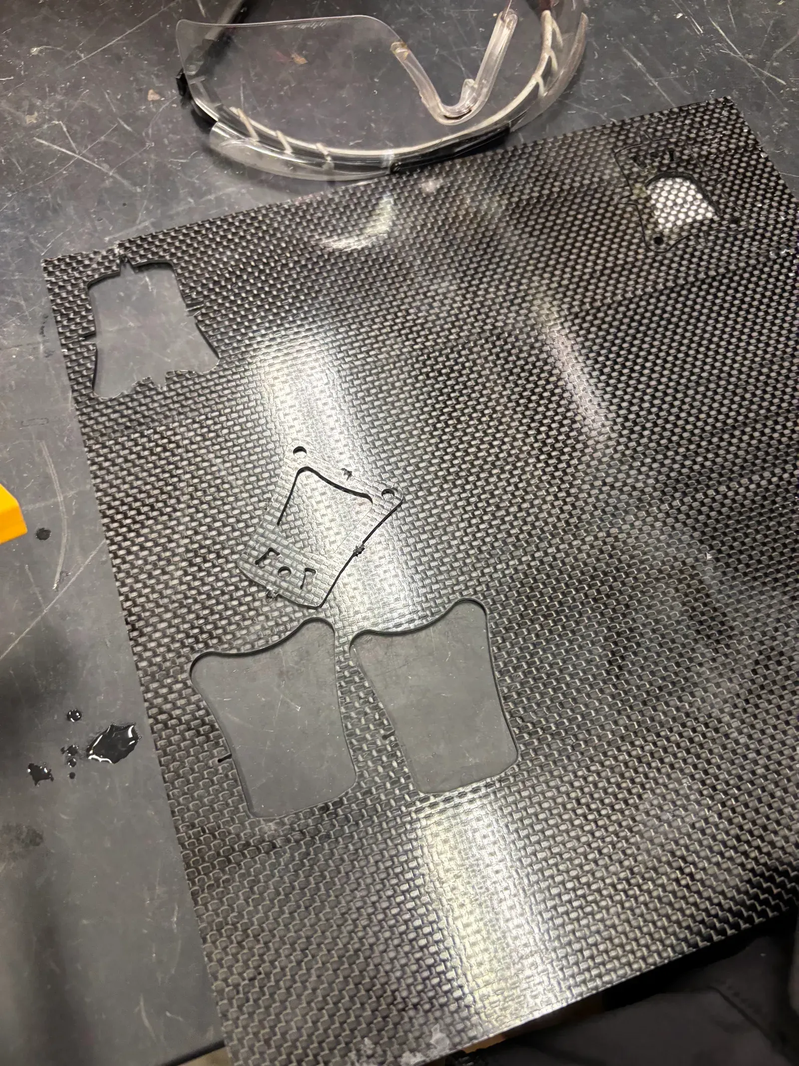 Carbon-fiber sheet on the waterjet bed after cutting