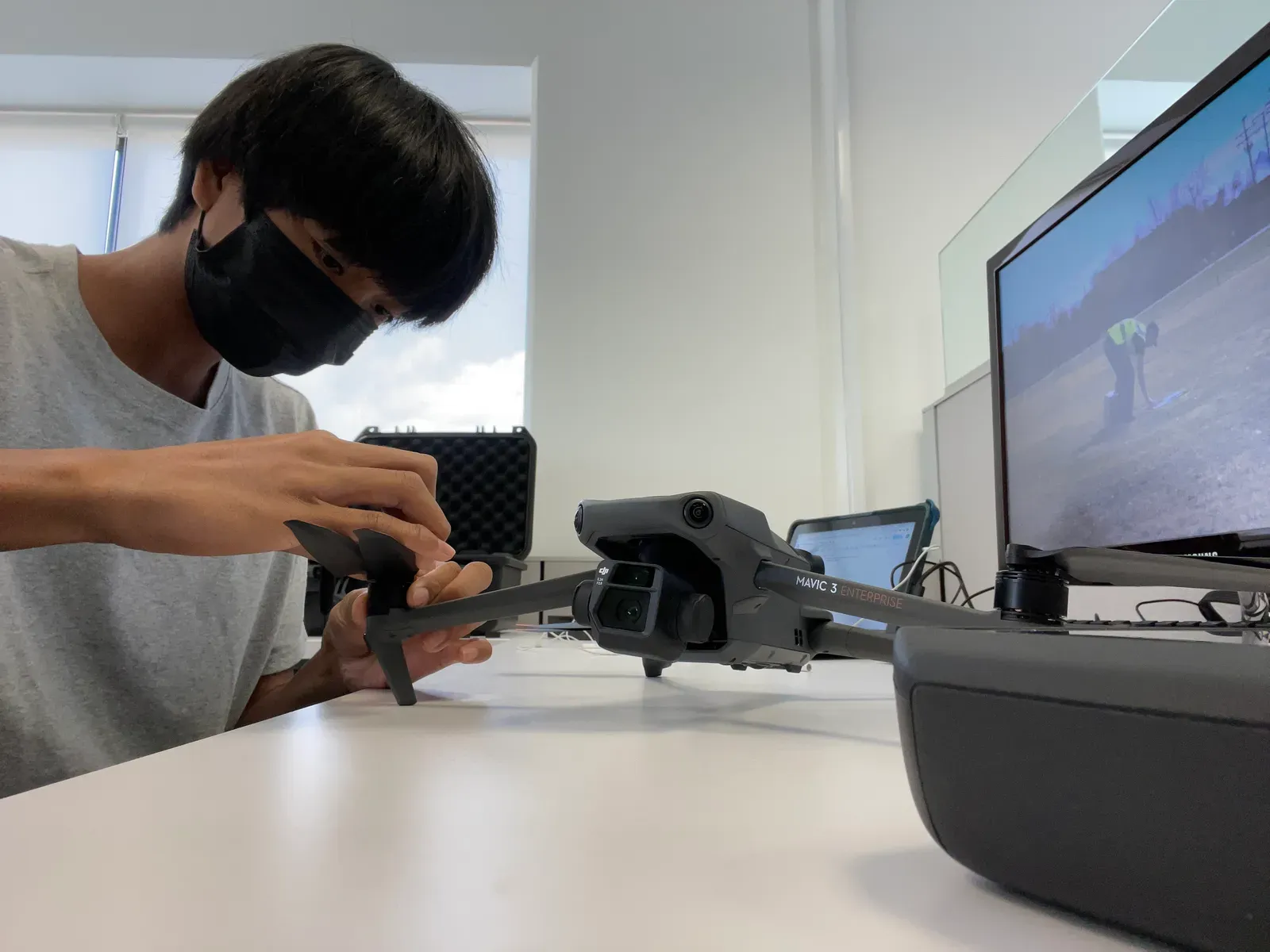 AJ setting up the DJI Mavic 3 Enterprise at a desk