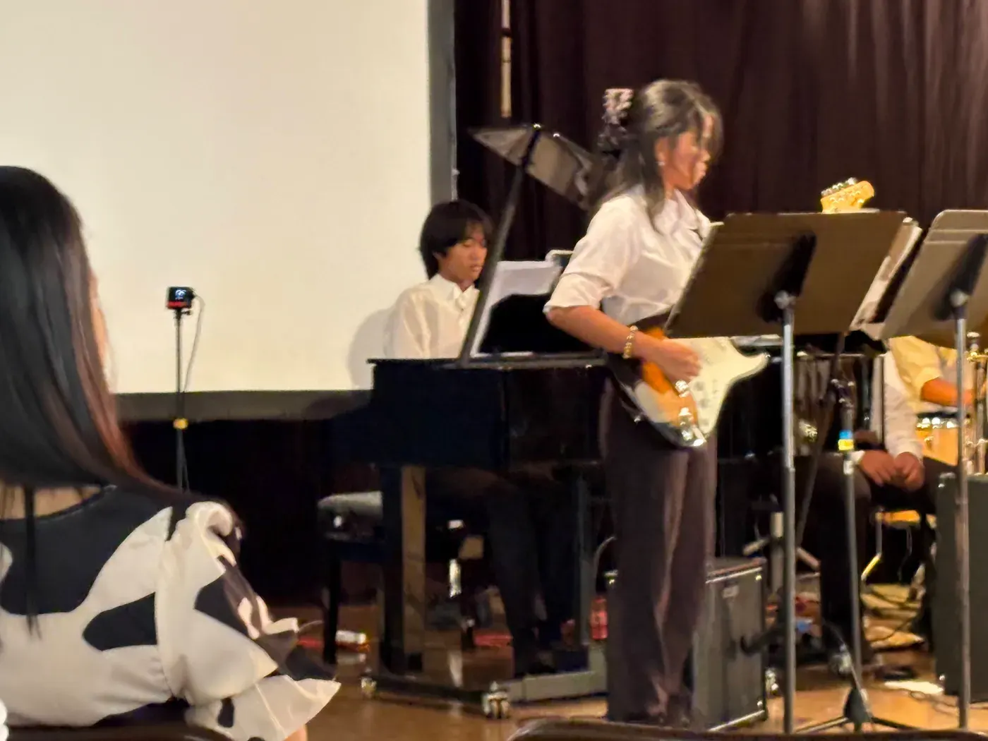 Playing bass guitar in a small combo