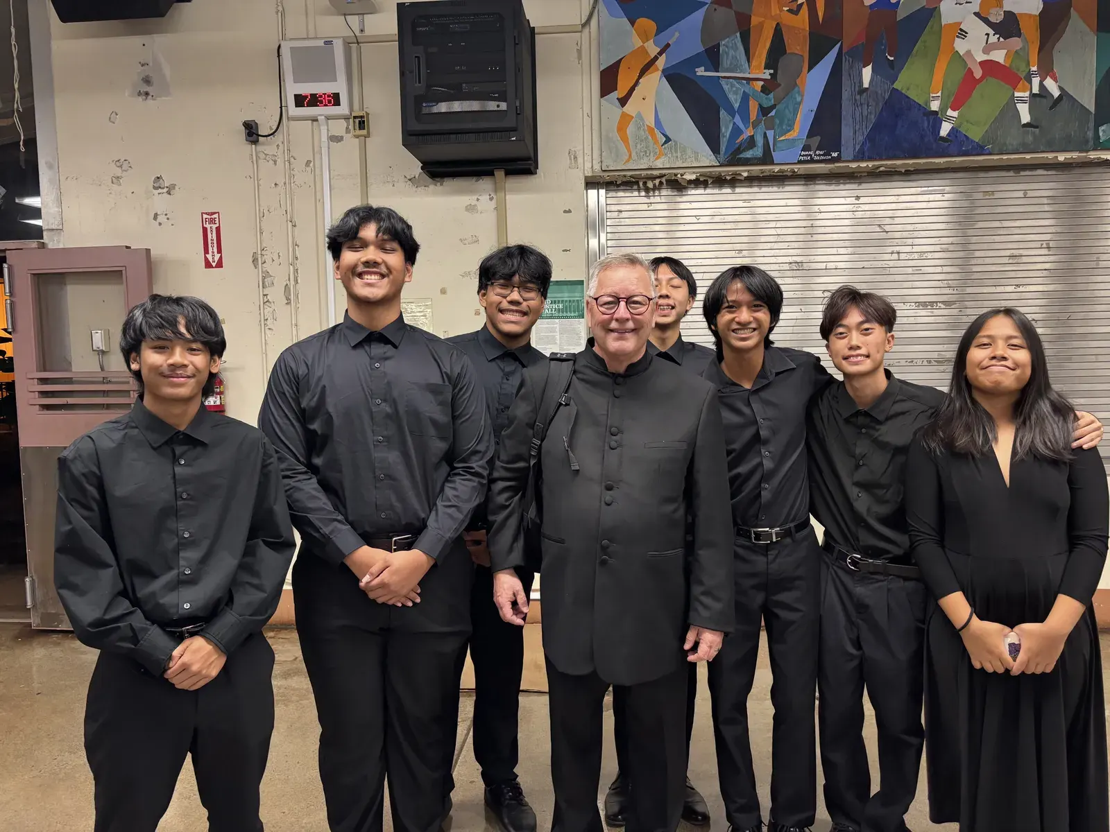 A formal concert ensemble in black