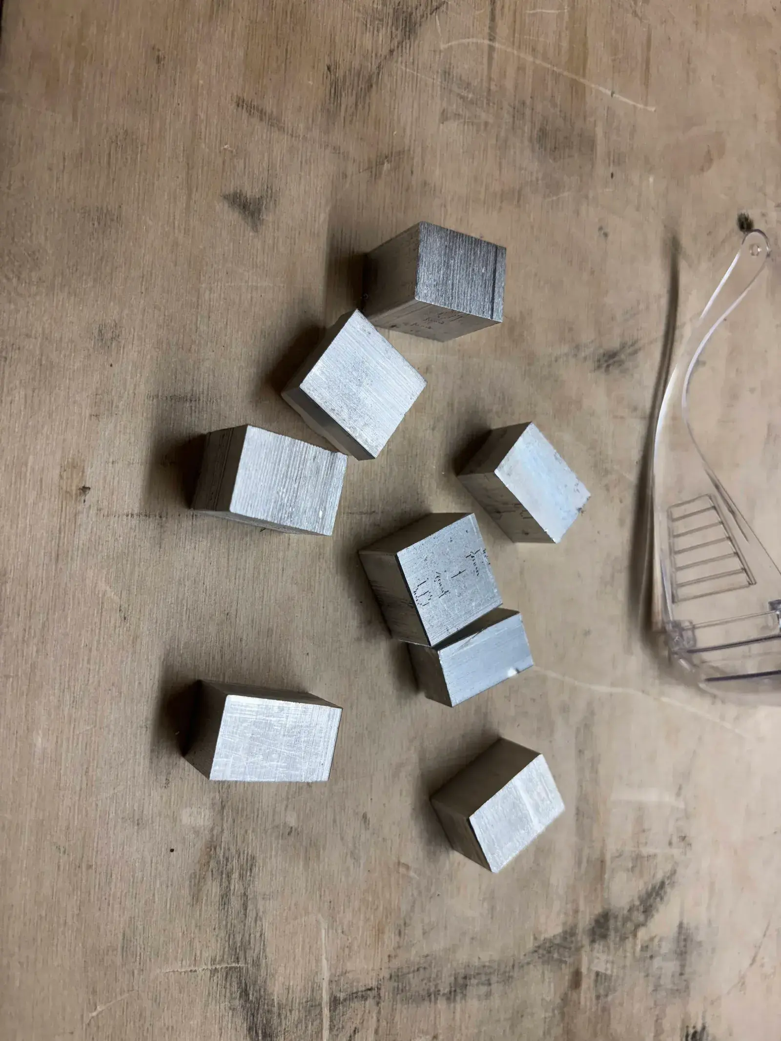 Machined aluminum blocks on the bench