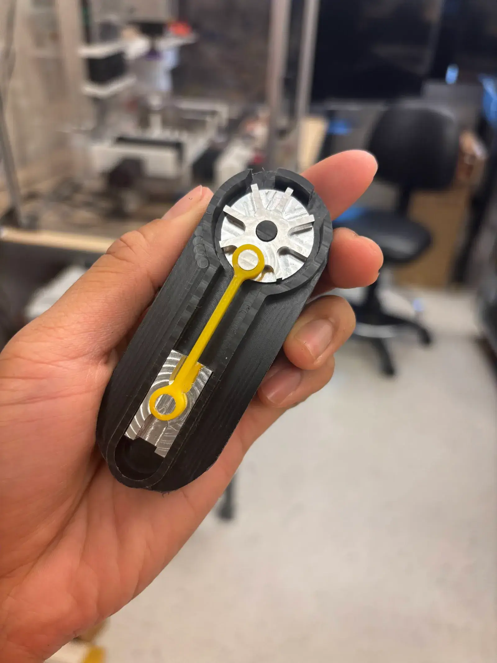 The Base, Slider, Crank teaching mechanism, machined and assembled, held in hand