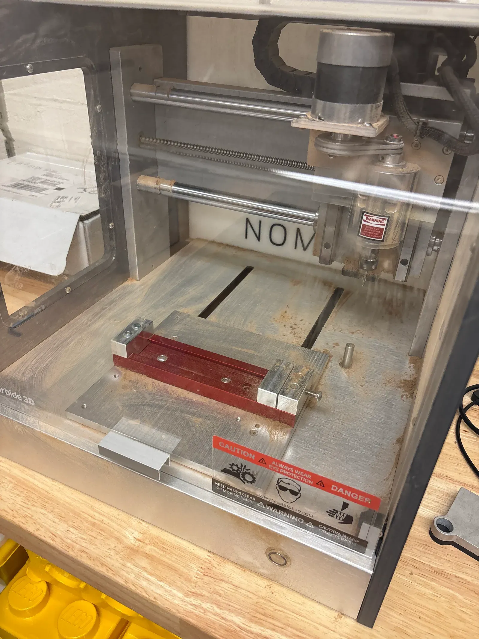 The desktop CNC with a part in a vise